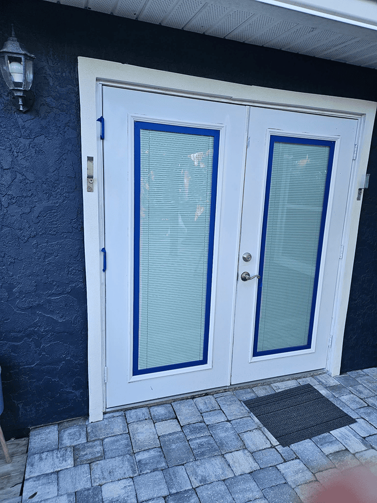 White double French doors with blue trim White double French doors with blue trim